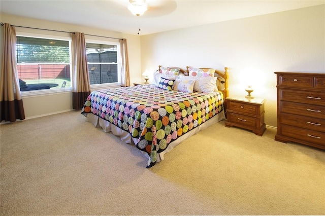 2418 Madeline Loop, Cedar Park, TX 78613 - bedroom featuring light carpet, baseboards, and ceiling fan