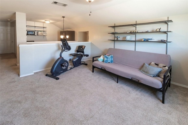 carpeted living area featuring baseboards, lofted ceiling, and a ceiling fan