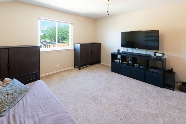 carpeted bedroom with baseboards