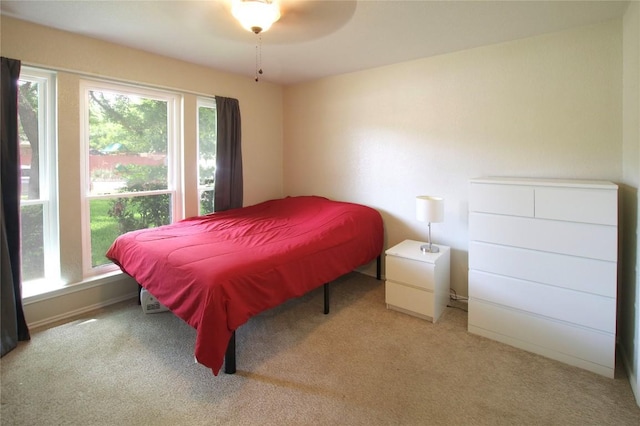 bedroom featuring light colored carpet