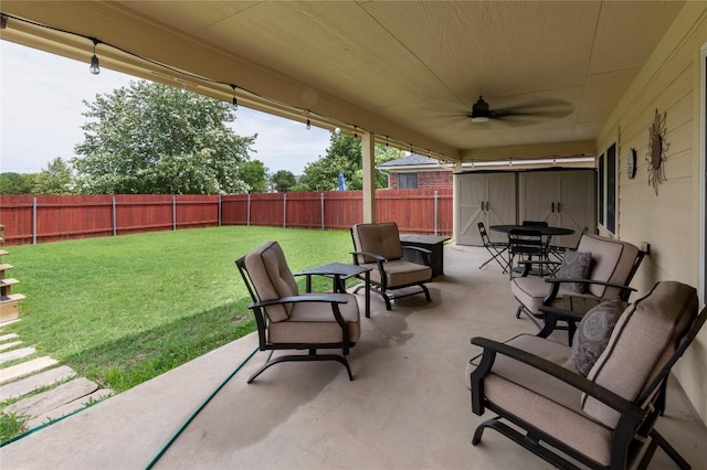 view of patio featuring outdoor dining space and a ceiling fan