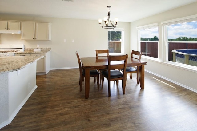2418 Madeline Loop, Cedar Park, TX 78613 - dining room with a chandelier, baseboards, and dark wood-style flooring