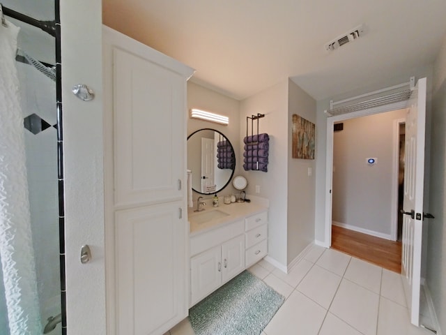 1127 Penion Dr, Austin, TX 78748 - full bathroom featuring vanity, a shower with curtain, and tile patterned floors