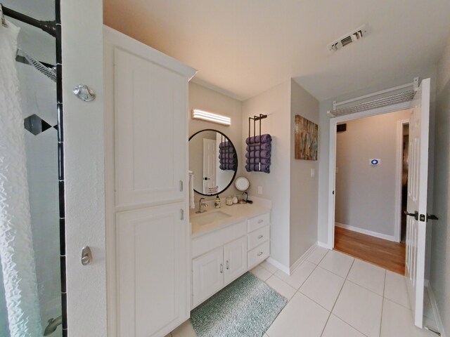 1127 Penion Dr, Austin, TX 78748 - bathroom with vanity, curtained shower, and tile patterned flooring