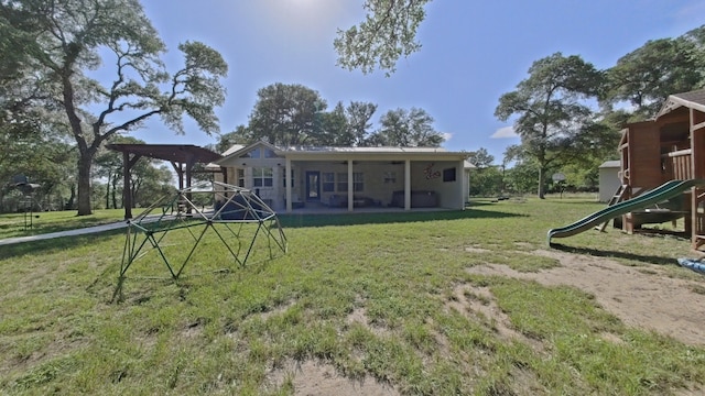 1127 Penion Dr, Austin, TX 78748 - back of house with a playground and a yard