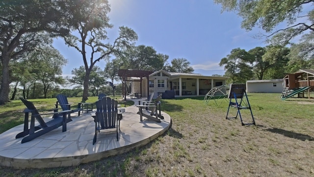 1127 Penion Dr, Austin, TX 78748 - view of green lawn with a playground and a patio area