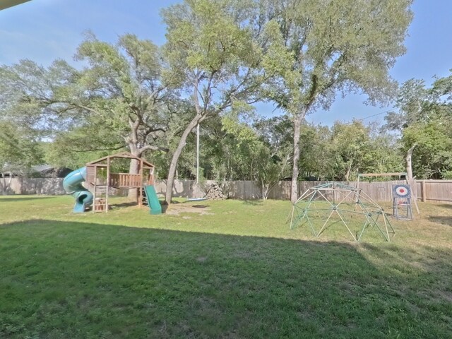 1127 Penion Dr, Austin, TX 78748 - fenced backyard featuring a playground