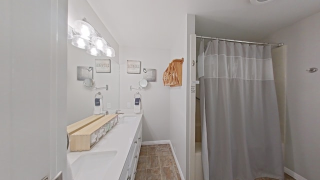 1127 Penion Dr, Austin, TX 78748 - full bath with double vanity and shower / bath combination with curtain