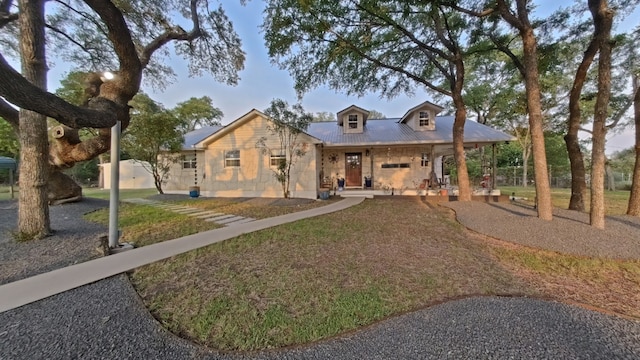 1127 Penion Dr, Austin, TX 78748 - view of front of property with covered porch and a metal roof