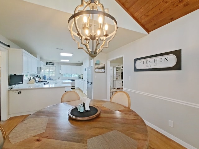 1127 Penion Dr, Austin, TX 78748 - dining space featuring a chandelier, vaulted ceiling, light wood-type flooring, and wooden ceiling