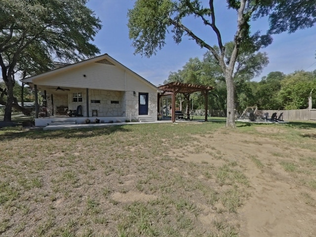 1127 Penion Dr, Austin, TX 78748 - rear view of house with a pergola, stone siding, a ceiling fan, and a patio area
