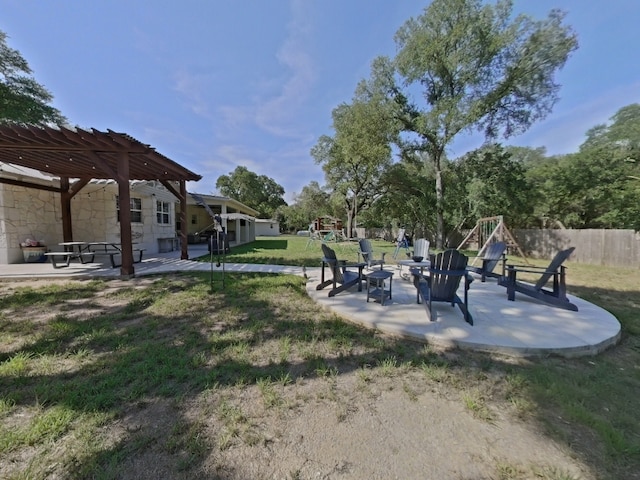1127 Penion Dr, Austin, TX 78748 - view of yard featuring a patio, a pergola, a fire pit, and a playground