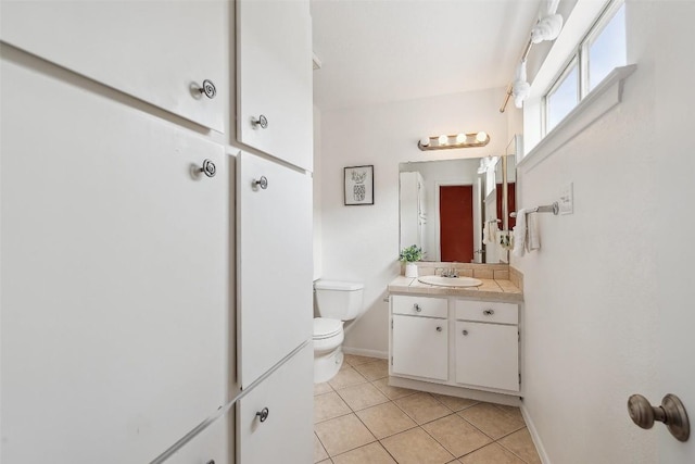 2104 Cullen Ave Unit 223, Austin, TX 78757 - bathroom featuring tile patterned floors, vanity, toilet, and baseboards