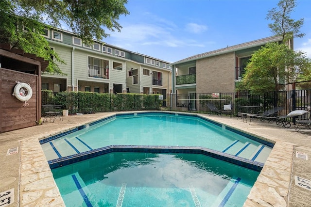 2104 Cullen Ave Unit 223, Austin, TX 78757 - view of swimming pool featuring fence and a pool with connected hot tub