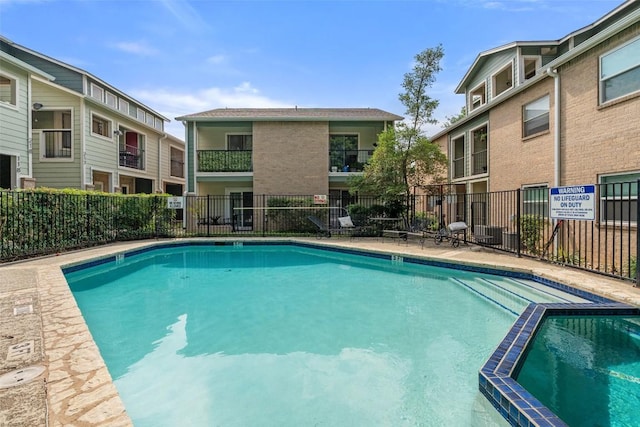 2104 Cullen Ave Unit 223, Austin, TX 78757 - view of swimming pool featuring a pool with connected hot tub