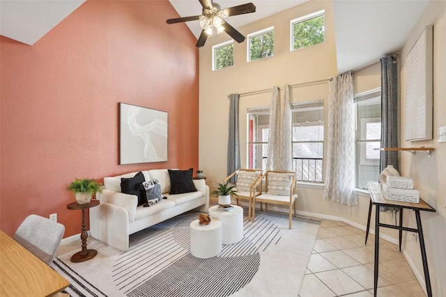 2104 Cullen Ave Unit 223, Austin, TX 78757 - living room featuring plenty of natural light, a ceiling fan, baseboards, high vaulted ceiling, and light tile patterned flooring