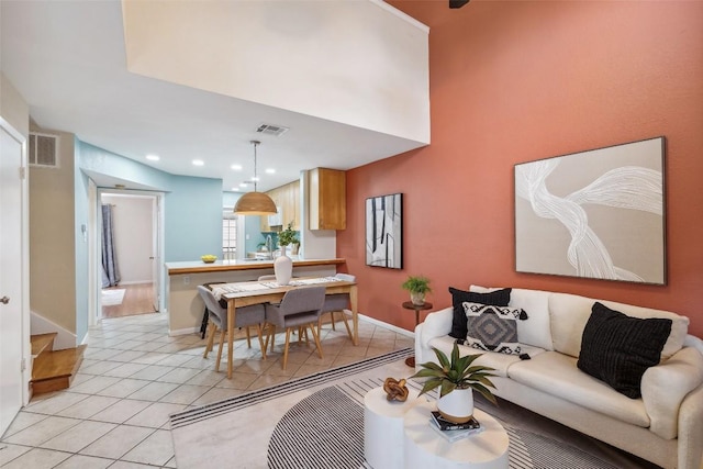 2104 Cullen Ave Unit 223, Austin, TX 78757 - living room featuring light tile patterned floors, baseboards, and recessed lighting