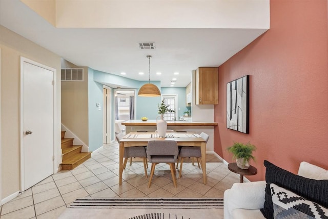 2104 Cullen Ave Unit 223, Austin, TX 78757 - dining room with stairway, light tile patterned floors, baseboards, and recessed lighting