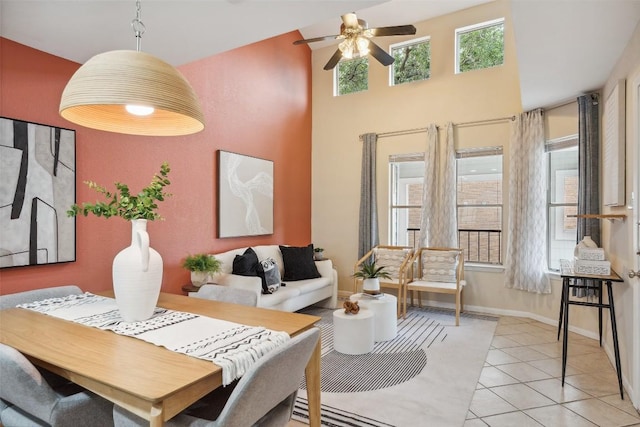 2104 Cullen Ave Unit 223, Austin, TX 78757 - dining space featuring ceiling fan, light tile patterned floors, baseboards, and a high ceiling
