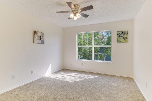 1905 Hollow Tree Blvd, Round Rock, TX 78681 - spare room featuring ceiling fan, light colored carpet, a textured ceiling, and baseboards