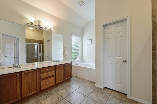 204 Saddleback Rd, Austin, TX 78737 - bathroom with a stall shower, a garden tub, double vanity, and vaulted ceiling