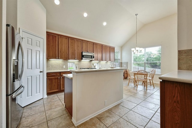 204 Saddleback Rd, Austin, TX 78737 - kitchen featuring stainless steel appliances, tasteful backsplash, light countertops, brown cabinets, and high vaulted ceiling