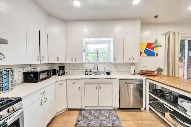 1901 E 10th St, Austin, TX 78702 - kitchen with a sink, stainless steel appliances, plenty of natural light, tasteful backsplash, and recessed lighting
