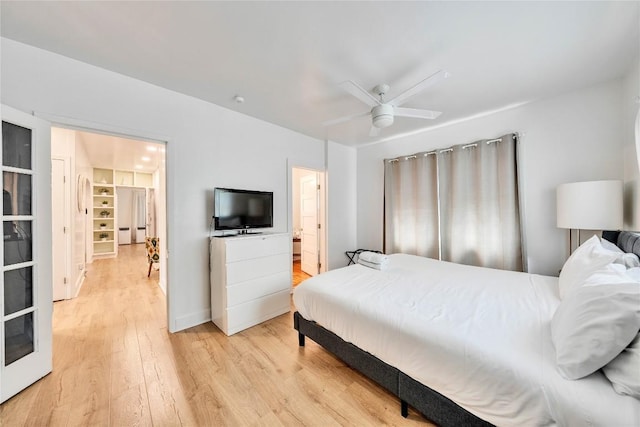 1901 E 10th St, Austin, TX 78702 - bedroom with light wood-style flooring and a ceiling fan
