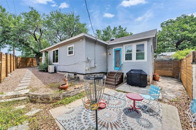 1901 E 10th St, Austin, TX 78702 - rear view of property with a patio area, a fenced backyard, and entry steps
