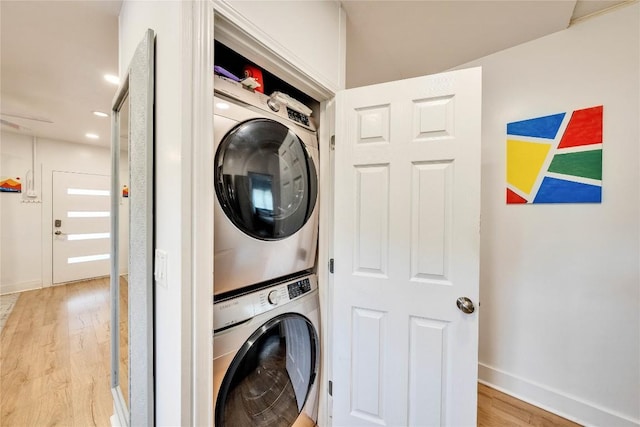 1901 E 10th St, Austin, TX 78702 - washroom featuring stacked washer / drying machine, light wood finished floors, baseboards, and recessed lighting