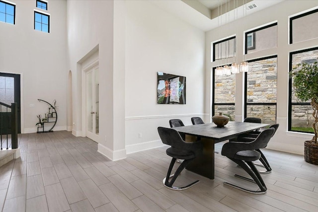 604 Rawson Bnd, Austin, TX 78738 - dining space with a towering ceiling and wood finished floors