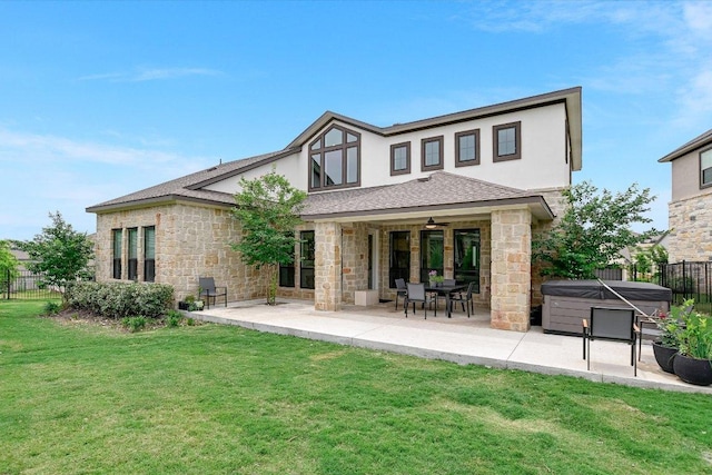 604 Rawson Bnd, Austin, TX 78738 - back of property featuring a hot tub, stone siding, a patio area, and stucco siding