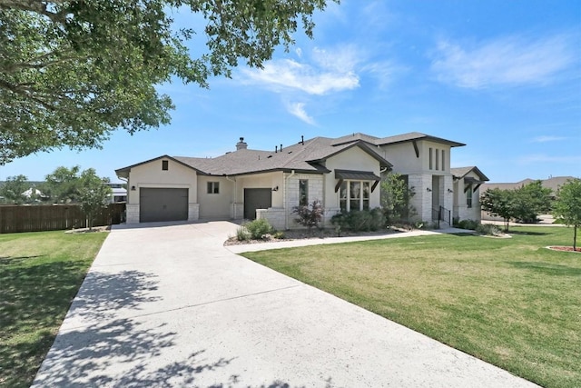 view of front of property with stucco siding, a garage, driveway, stone siding, and a chimney