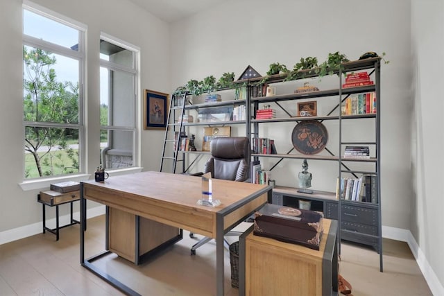 office space with baseboards