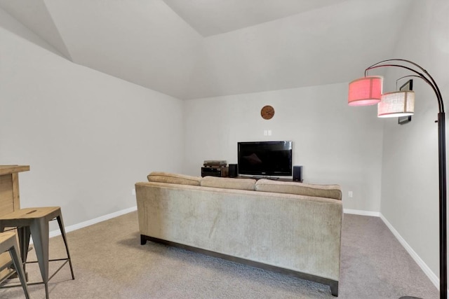 living room with light colored carpet, baseboards, and vaulted ceiling