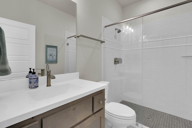 full bath with toilet, a stall shower, and vanity