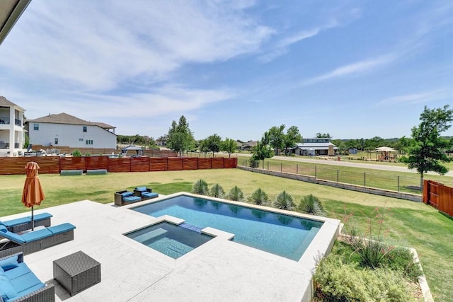 view of pool with a patio and a pool with connected hot tub