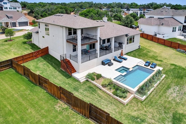 rear view of house with outdoor lounge area, a shingled roof, a residential view, and a patio