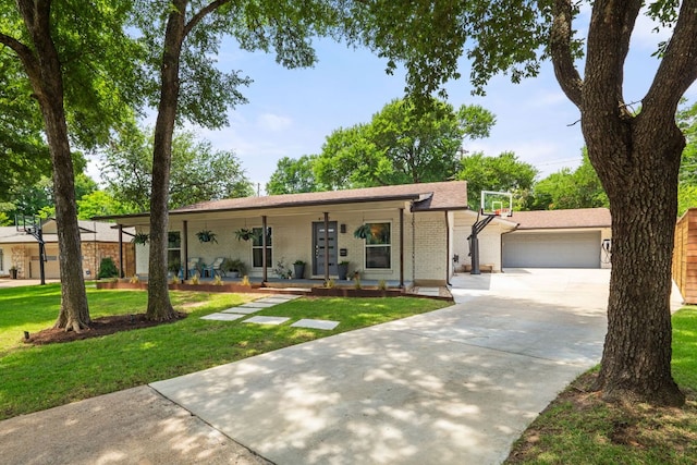 4107 Circletree Loop, Austin, TX 78731 - ranch-style house with a porch, a front lawn, driveway, brick siding, and an attached garage