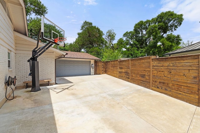 4107 Circletree Loop, Austin, TX 78731 - view of patio / terrace with a garage, fence, and driveway