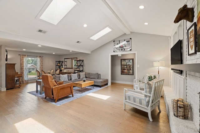 4107 Circletree Loop, Austin, TX 78731 - living room featuring light wood-type flooring, a skylight, recessed lighting, and a brick fireplace