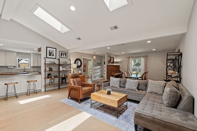 4107 Circletree Loop, Austin, TX 78731 - living room featuring light wood-style flooring, a skylight, and recessed lighting