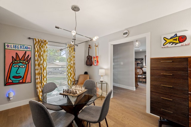 4107 Circletree Loop, Austin, TX 78731 - dining room with light wood finished floors and baseboards