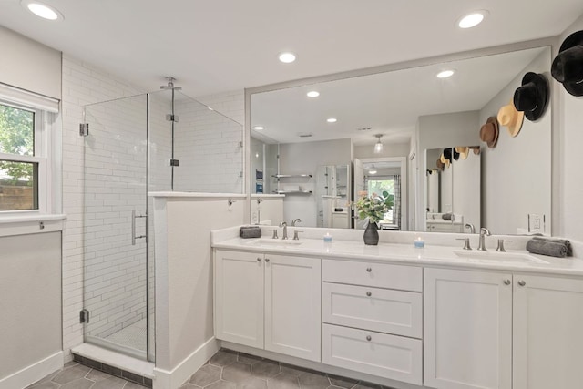 4107 Circletree Loop, Austin, TX 78731 - bathroom featuring tile patterned floors, a shower stall, recessed lighting, and double vanity
