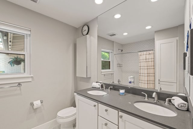 4107 Circletree Loop, Austin, TX 78731 - full bathroom with double vanity, curtained shower, and recessed lighting