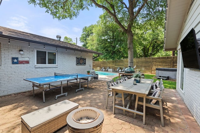 4107 Circletree Loop, Austin, TX 78731 - fenced backyard featuring a patio, outdoor dining area, an outdoor fire pit, and a hot tub