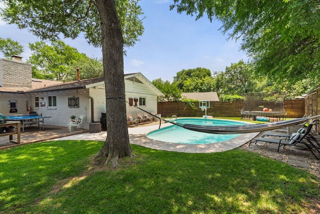 4107 Circletree Loop, Austin, TX 78731 - view of pool with a trampoline, a fenced backyard, and a patio