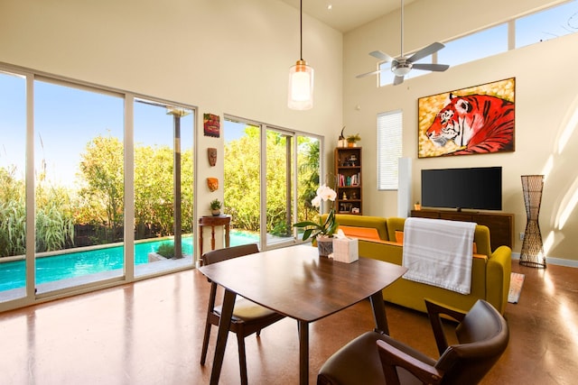 5309 Sendero Hills Pkwy, Austin, TX 78724 - dining space with a high ceiling, a ceiling fan, and finished concrete flooring