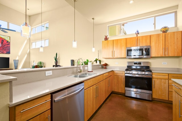 5309 Sendero Hills Pkwy, Austin, TX 78724 - kitchen featuring appliances with stainless steel finishes, a sink, a towering ceiling, light countertops, and concrete floors