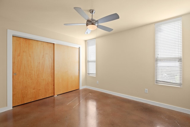 5309 Sendero Hills Pkwy, Austin, TX 78724 - unfurnished bedroom with finished concrete floors, baseboards, a closet, and ceiling fan
